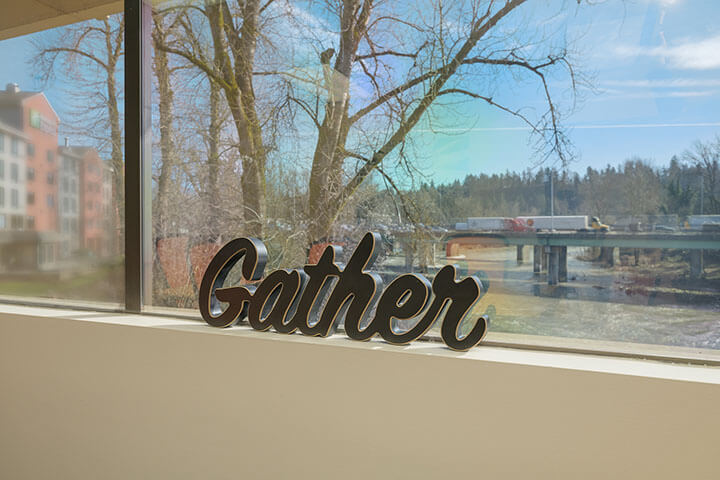 Gather sign with view of Clackamas River in Gladstone Oregon